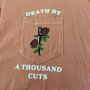 Death by a thousand cuts pocket tee